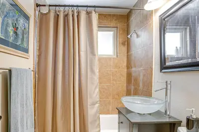 a bathroom with a sink and a shower curtain at 6 Mi to Dtwn Denver Escape with Fire Pit in Denver