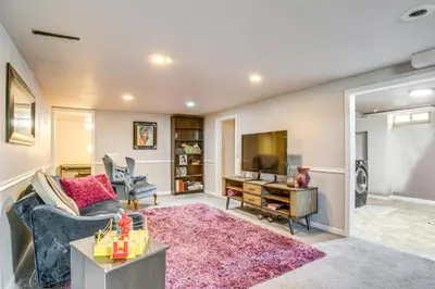 a living room with a couch and a tv at 6 Mi to Dtwn Denver Escape with Fire Pit in Denver