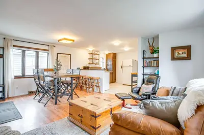 a living room with a couch and a table at Hike, Ski and More Walkable Downtown Granby Home in Granby
