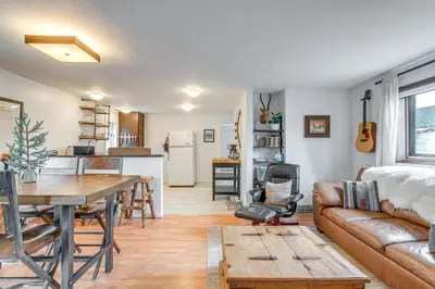 a living room with a couch and a table at Hike, Ski and More Walkable Downtown Granby Home in Granby