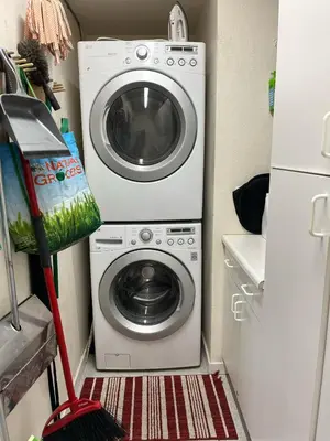a washer and dryer in a small room at Creekside Craftsman Cabin with Jacuzzi - Alpine Splendor 6 Mins to downtown in Boulder