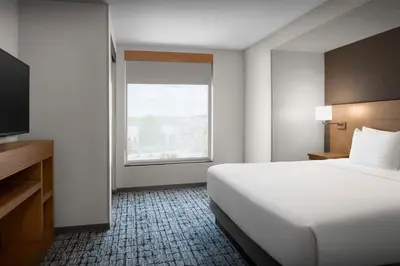 a hotel room with a large bed and a window at Hyatt Place Boulder Pearl Street - Newly Renovated in Boulder