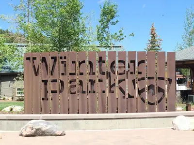 a sign that says northwestern park on a wooden fence at Ski-In Ski-Out Condo at Zephyr Mountain Lodge 1518 in Winter Park
