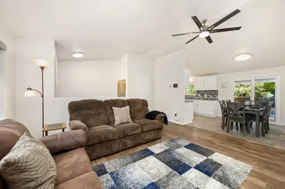 a living room with a couch and a table at RMNP Retreat Group Friendly Home near Estes Park in Loveland