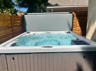 a hot tub on the back of a backyard at Walk to Dining Breweries and Shops Plus New Hot Tub in Louisville
