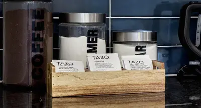 a wooden crate with three jars of teazos at Spacious and Cozy 5 Bed 3 Bath Vacation House W 2 King 3 Queen! Sleep 12! 15Min to Red Rocks in Arvada