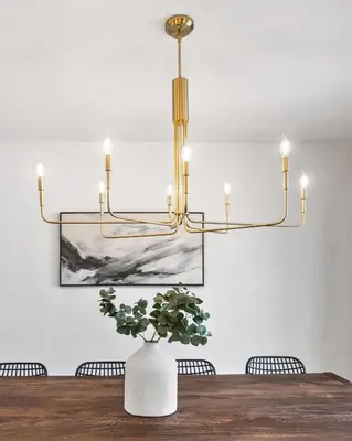 a chandelier in a dining room with a wooden table at Spacious and Cozy 5 Bed 3 Bath Vacation House W 2 King 3 Queen! Sleep 12! 15Min to Red Rocks in Arvada