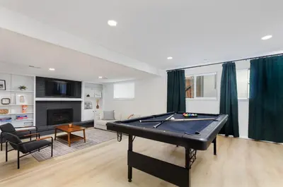 a living room with a pool table in it at Spacious and Cozy 5 Bed 3 Bath Vacation House W 2 King 3 Queen! Sleep 12! 15Min to Red Rocks in Arvada
