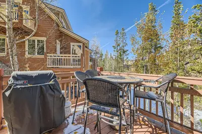a patio with chairs and a table on a deck at 6507 Settlers Creek Townhomes townhouse in Keystone