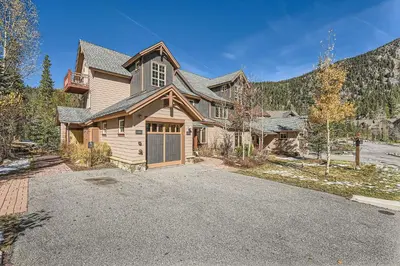 a large house with a garage and a driveway at 6507 Settlers Creek Townhomes townhouse in Keystone