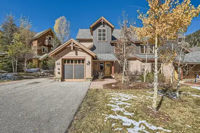 a large house with a driveway in front of it at 6507 Settlers Creek Townhomes townhouse in Keystone