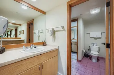 a bathroom with a sink and a toilet at 1483 Lakeside condo in Keystone