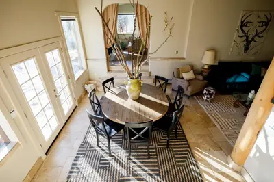a dining room with a table and chairs at Mountain cabin w game room & hot tub in Bailey
