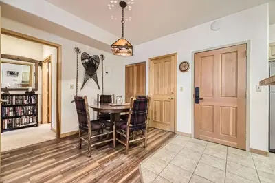 a dining room with a table and chairs at 5023 Gateway condo in Keystone