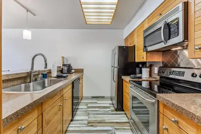 a kitchen with a sink and a microwave at Keystone Retreat with Resort Amenities in Keystone