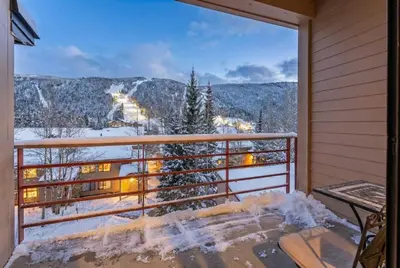 a balcony with a view of the snow covered mountains at Keystone Retreat with Resort Amenities in Keystone