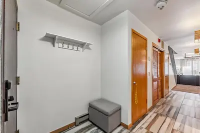 a hallway with a stool in front of a door at Keystone Retreat with Resort Amenities in Keystone