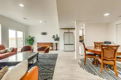 a living room with a table and chairs and a kitchen at Family-Friendly Aurora Apt with Shared Patio! in Aurora