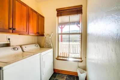 a small kitchen with a sink and a window at Mtn Views and Private Hot Tub Granby Group Getaway! in Granby