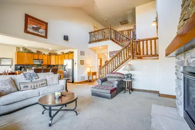 a living room with a couch and a fireplace at Mtn Views and Private Hot Tub Granby Group Getaway! in Granby