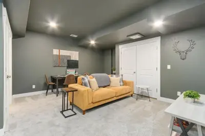 a living room with a couch and a table at NOCO Retreat with King Beds, Fireplace, Scenic Trails in Loveland
