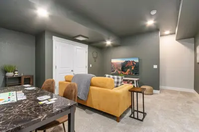 a living room with a couch and a table at NOCO Retreat with King Beds, Fireplace, Scenic Trails in Loveland