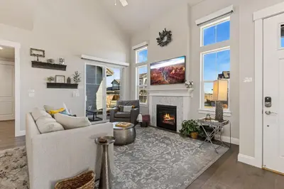 a living room with a couch and a fireplace at Colorado Modern Retreat with King Beds, Pickleball in Loveland