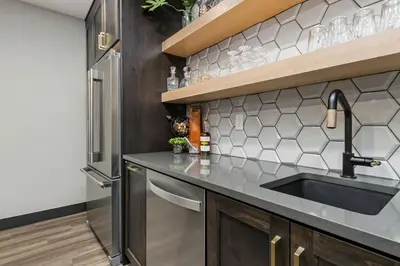 a kitchen with a sink and a refrigerator at Colorado Modern Retreat with King Beds, Pickleball in Loveland
