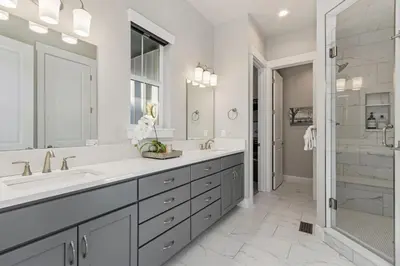 a white bathroom with two sinks and a shower at Colorado Modern Retreat with King Beds, Pickleball in Loveland