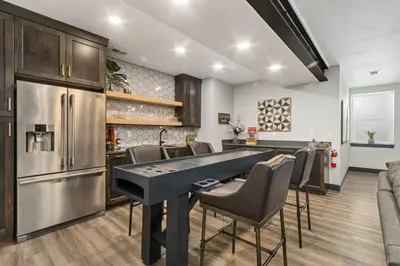 a kitchen and dining room with a ping pong table at Colorado Modern Retreat with King Beds, Pickleball in Loveland