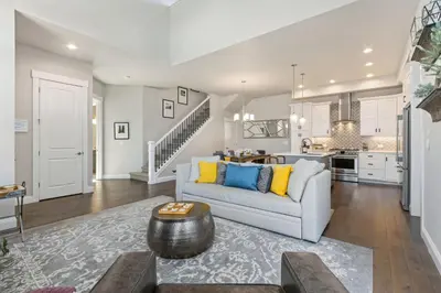 a living room with a couch and a kitchen at Colorado Modern Retreat with King Beds, Pickleball in Loveland