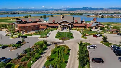 an aerial view of a large building with a parking lot at Colorado Modern Retreat with King Beds, Pickleball in Loveland