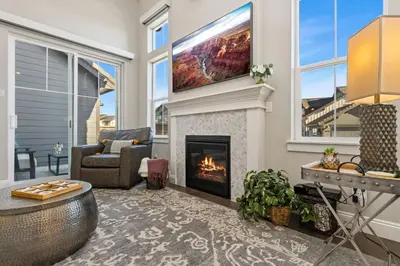 a living room with a fireplace and a tv at Colorado Modern Retreat with King Beds, Pickleball in Loveland