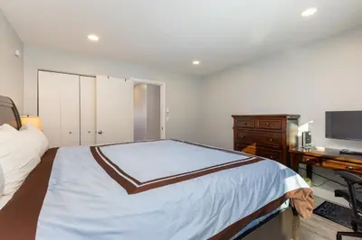 a bedroom with a bed and a desk and a television at Meadow Cove B1 condo in Dillon