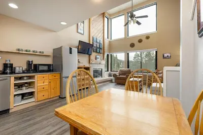 a kitchen and dining room with a table and chairs at The Mall 1429 condo in Keystone