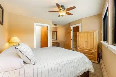a bedroom with a bed and a ceiling fan at The Mall 1429 condo in Keystone