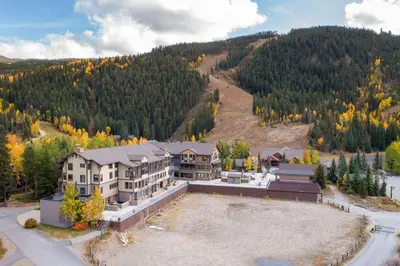 an aerial view of a large house in the mountains at 2797 Slopeside condo in Keystone