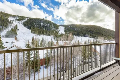a balcony with a view of a snow covered mountain at 2797 Slopeside condo in Keystone