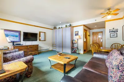 a living room with a couch and a table at 2797 Slopeside condo in Keystone