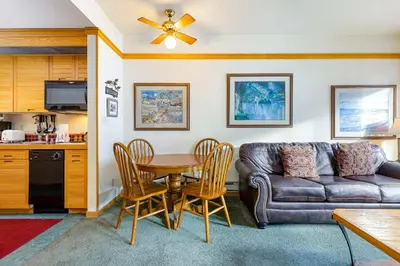a living room with a couch and a table at 2797 Slopeside condo in Keystone