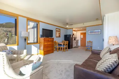 a living room with a couch and chairs and a table at 2756 Slopeside condo in Keystone