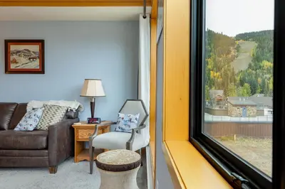 a living room with a couch and a window at 2756 Slopeside condo in Keystone