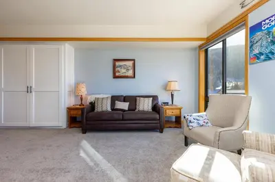 a living room with a couch and a chair at 2756 Slopeside condo in Keystone