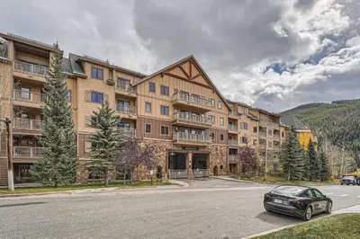 a car parked in front of a large building at 2263 Red Hawk Lodge condo in Keystone