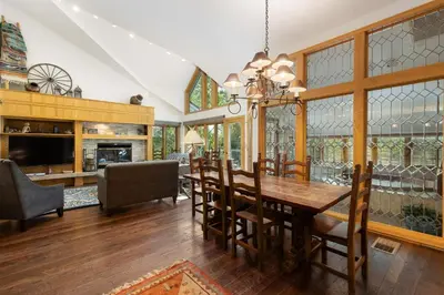 a dining room with a table and chairs at 2708 Chateaux DMont condo in Keystone