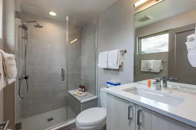 a bathroom with a toilet and a sink and a shower at Keystone Adventures Basecamp townhouse in Keystone