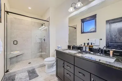 a bathroom with a shower and a sink and a toilet at 58 River Run Townhomes townhouse in Keystone