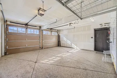 an empty garage with a garage door and a garage at 58 River Run Townhomes townhouse in Keystone