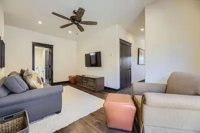 a living room with a couch and a ceiling fan at 58 River Run Townhomes townhouse in Keystone