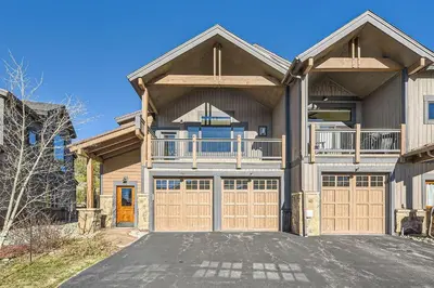 a large house with a garage at 58 River Run Townhomes townhouse in Keystone